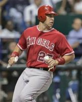 Mark Teixeira looks on after scoring a run.jpg