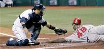 Torii Hunter is tagged out at home.jpg