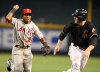 Erick Aybar chases down Mark Reynolds.jpg