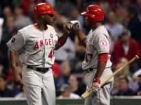 Torii Hunter gets congratulations from Howie Kendrick.JPG