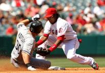 Erick Aybar tags out the runner at second base.JPG