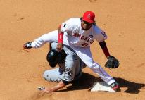 Erick Aybar avoids the runner and tries to complete the double play.JPG