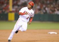Erick Aybar rounds second and heads towards third base.JPG
