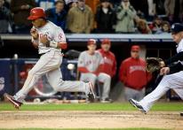 Erick Aybar scores on the wild pitch.JPG