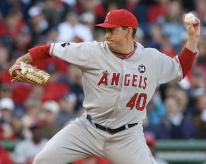 Brian Fuentes stretches and throws against Boston.JPG