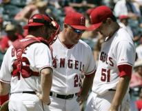budde-mike-butcher-joe-saunders-capt. .athletics_angels_baseball_ans108.jpg