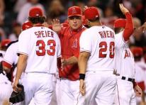 team-congratulate-capt. .mariners_angels_baseball_ans119.jpg