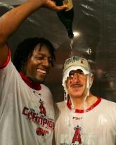 vladimir guerrero dumps champagne on art moreno.jpg