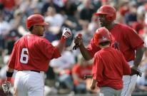 Torii Hunter is congratulated by Maicer Izturis.jpg