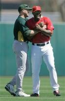 Torii Hunter is hugged by Mike Sweeney.jpg