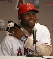 Torrin Hunter places rally monkey on is right shoulder during press conference.jpg