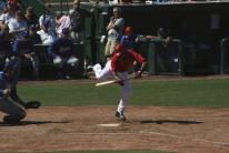 Erick Aybar jumps out of the way to avoid wild pitch.jpg