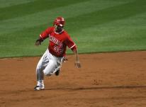 Erick Aybar zooms around second base going to third.jpg