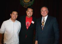 Mike Scioscia takes a pic with two fans.jpg