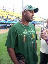 Kelvin Escobar in green hat and shirt.jpg