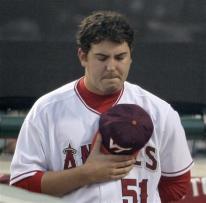 Joe Saunders holds a Virginia Tech cap to his chest.jpg