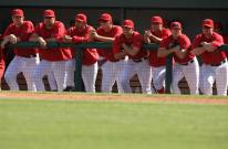 Angels players lean on the dugout railing.jpg